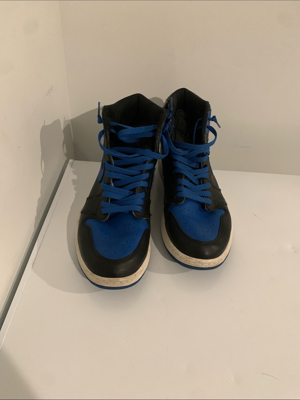 Jordan’s Black and Blue High-Top Sneakers with Blue Laces